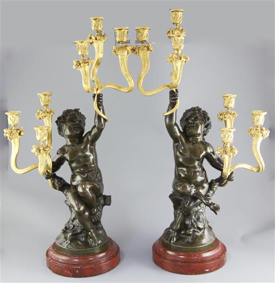 After Clodion. A pair of bronze and ormolu six light candelabra, height 28.5in.